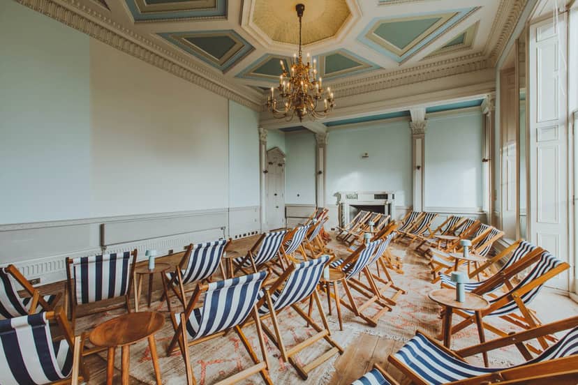 Stylish screening room with deck chairs for creative brainstorming and networking events.
