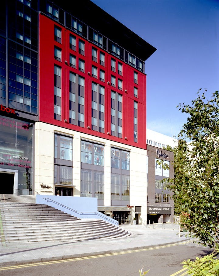 Modern venue Work + Play 4 in Birmingham with striking red facade for events and meetings.
