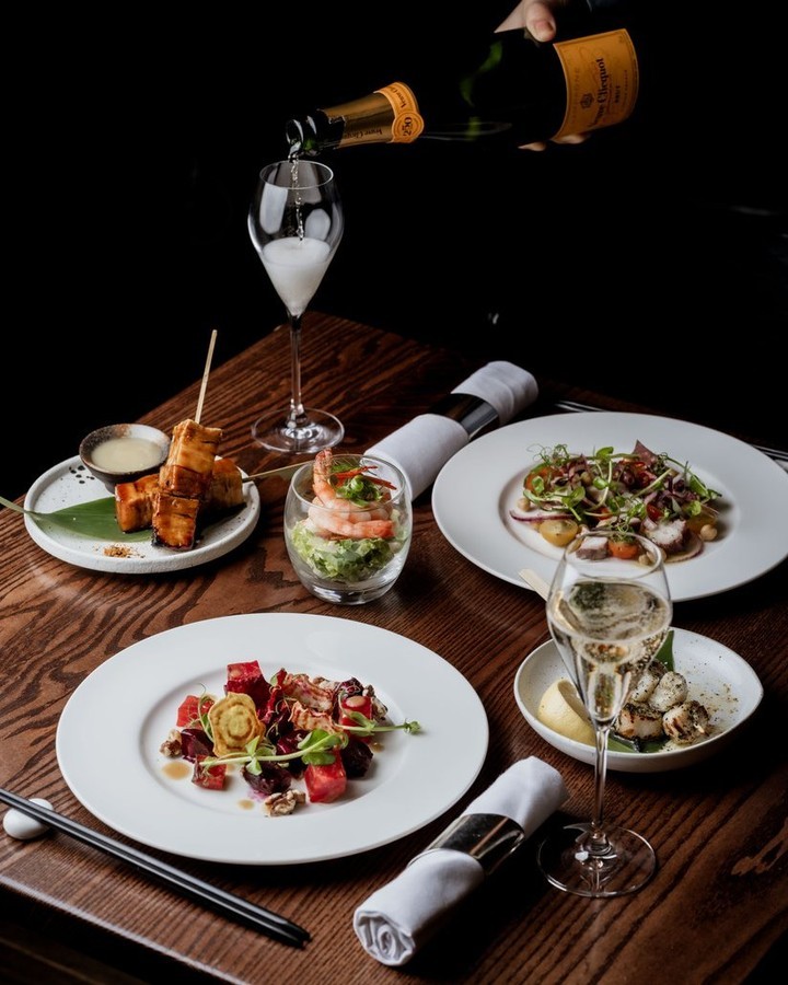 Elegant table setting at TOKii, gourmet dishes for upscale events and corporate functions. - Banner