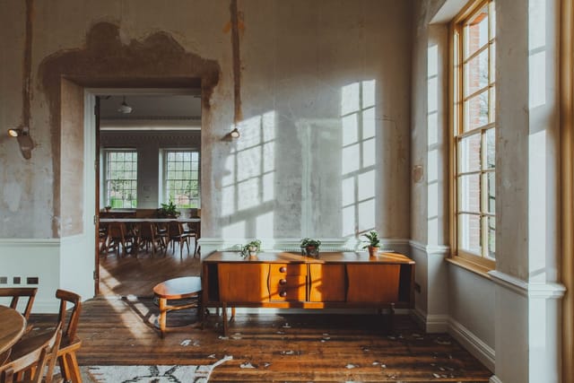 Charming rustic event space with natural light, ideal for intimate gatherings and workshops.