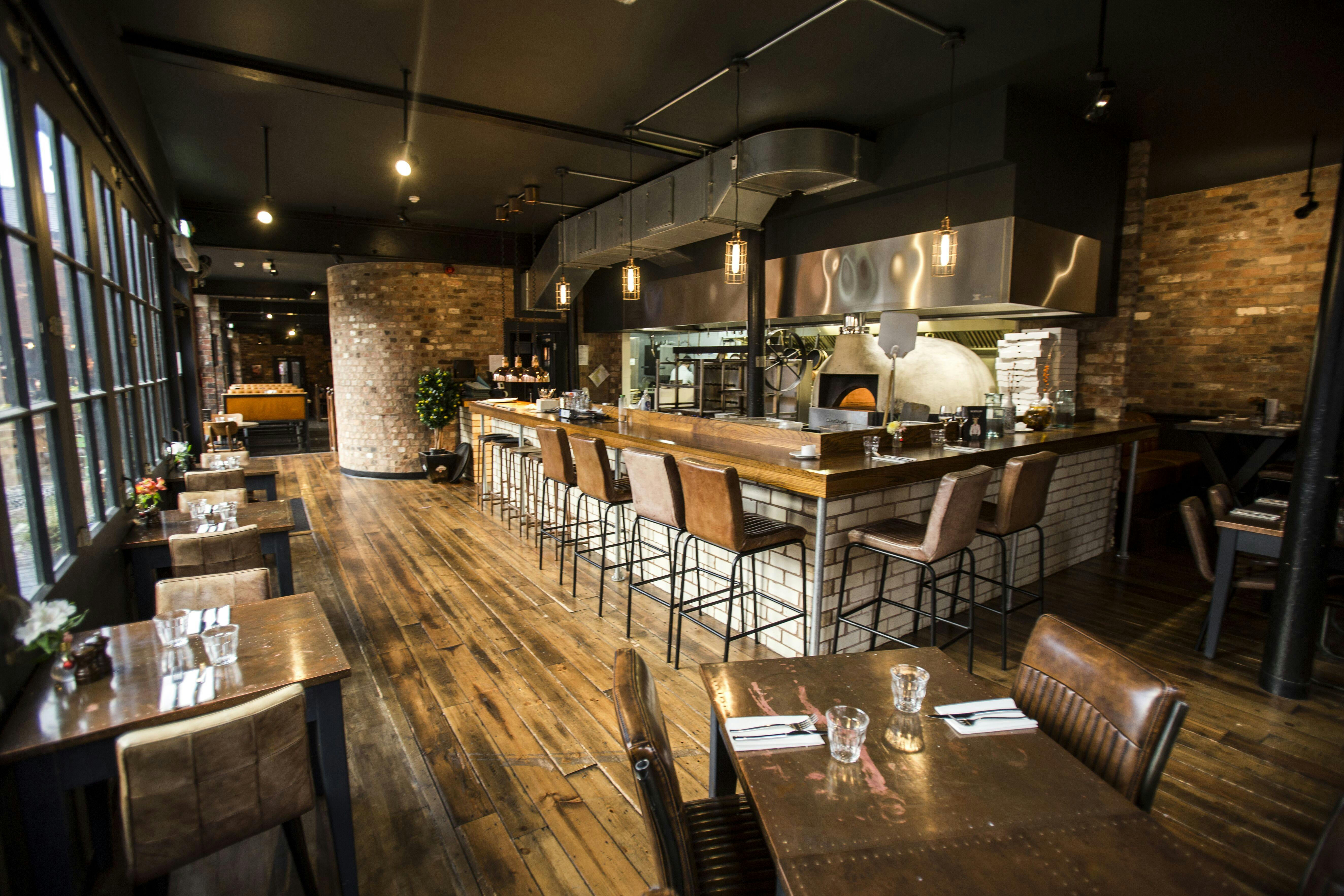 Modern restaurant in The Distillery Birmingham with open kitchen, ideal for events.