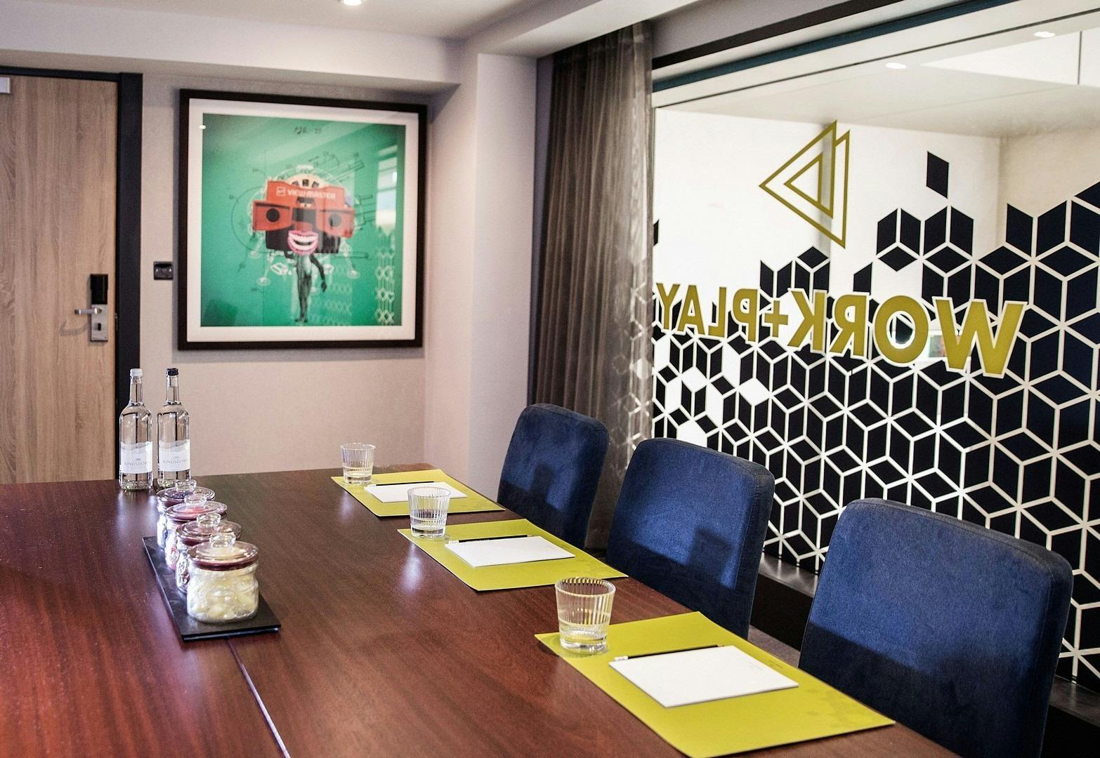 Modern meeting room in Malmaison Birmingham with sleek table, ideal for collaboration events.