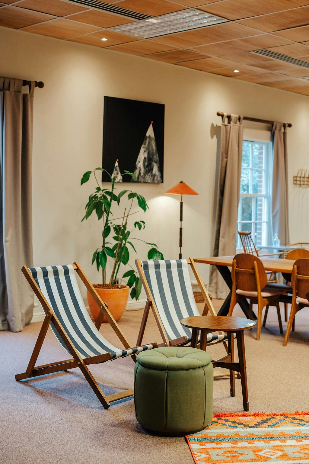 Cozy meeting space with striped deck chairs for networking and collaboration events.