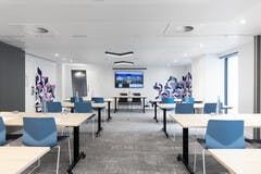 Modern meeting room in YOTEL Edinburgh, featuring flexible seating for workshops and corporate events.