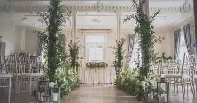 Elegant event space at Berwick Lodge, ideal for weddings with lush greenery and floral decor.