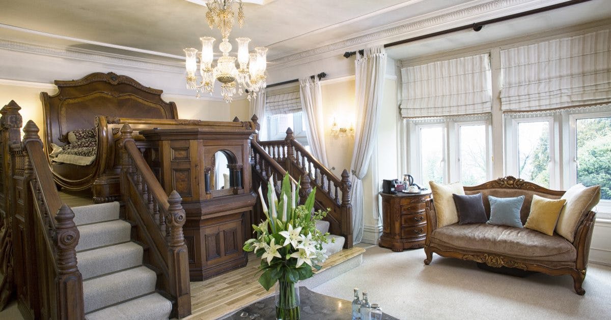 Elegant meeting space at Berwick Lodge with ornate staircase, perfect for gatherings.