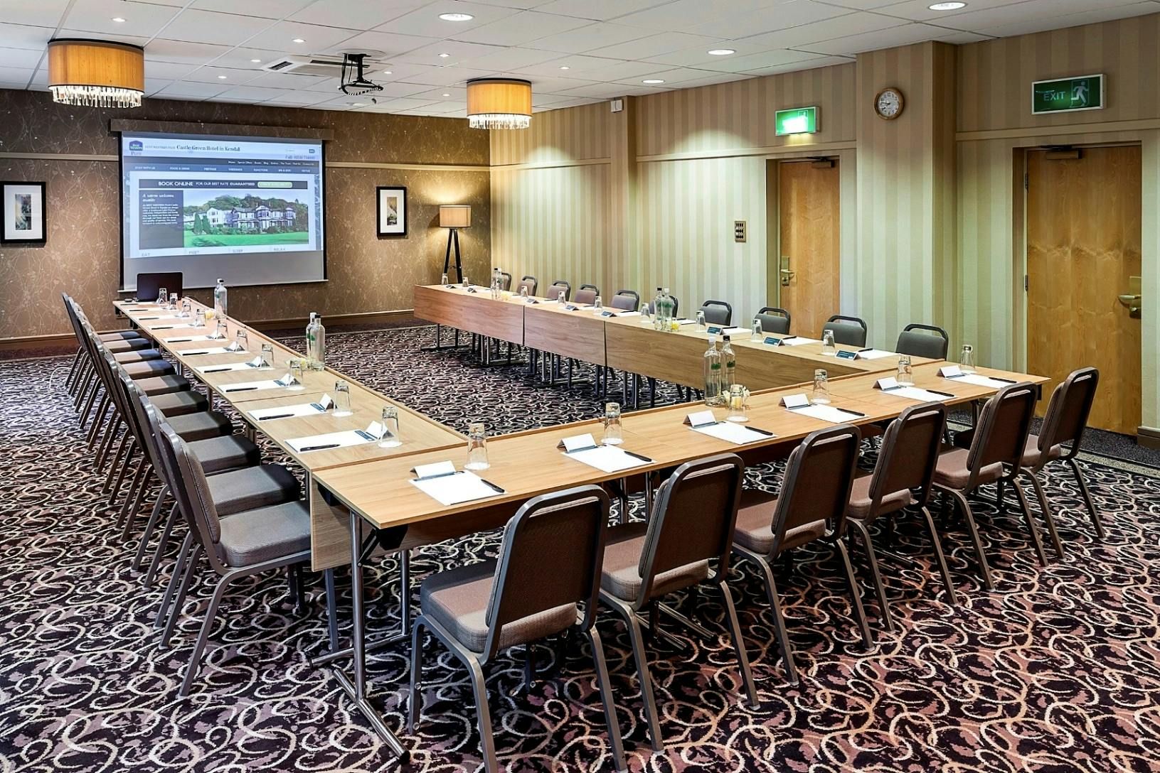 Oak Room at Castle Green Hotel, elegant meeting space with projector for professional events.