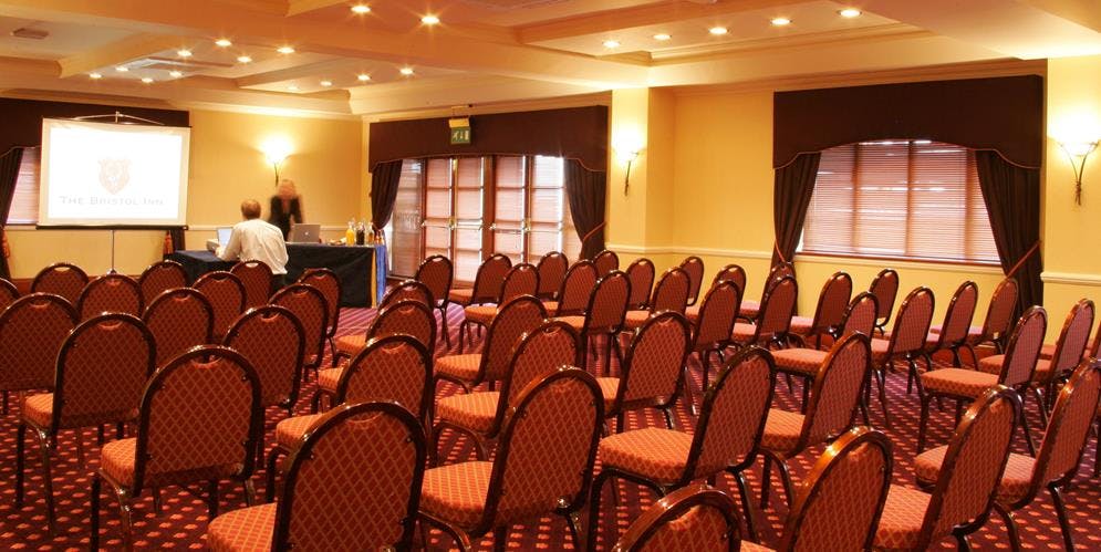 Bristol Suite meeting room with upholstered chairs, ready for professional events.