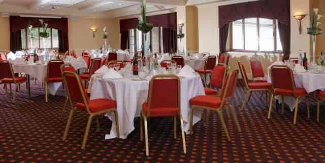 Bristol Suite at The Gables Hotel, elegant round tables for corporate events and banquets.