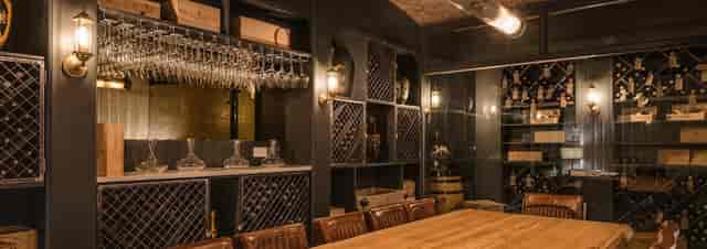 Sophisticated meeting space with wooden table and leather chairs at King Street Townhouse.