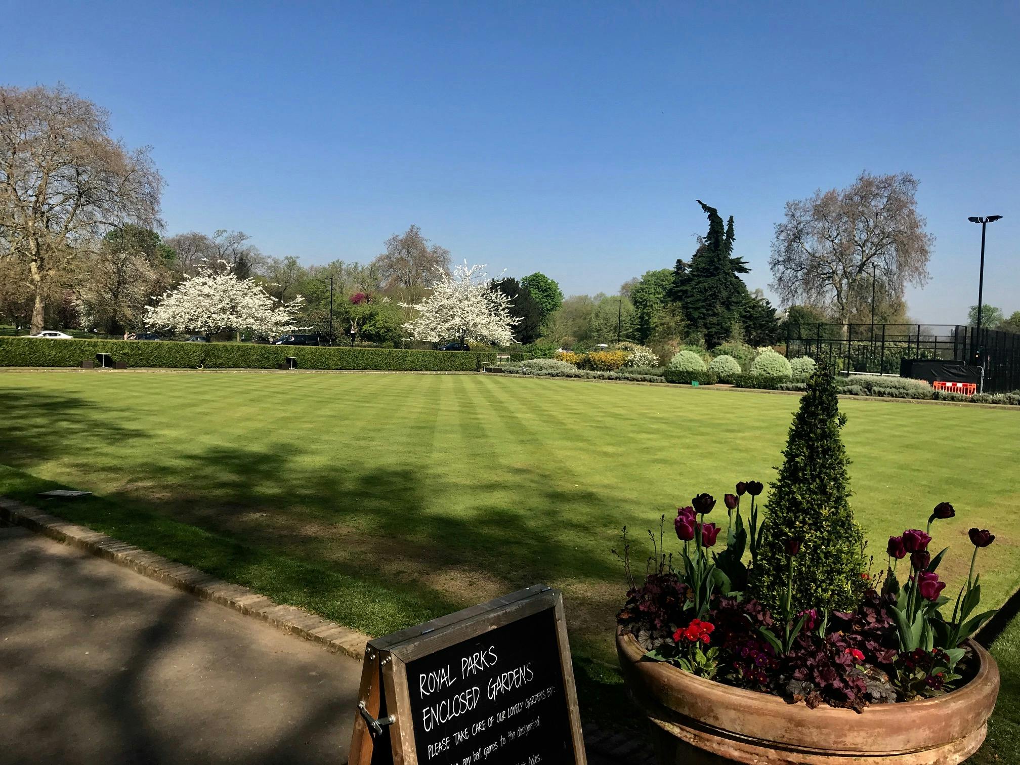 Pavilion Gardens in Hyde Park: lush lawn, vibrant flowers for garden parties and events.