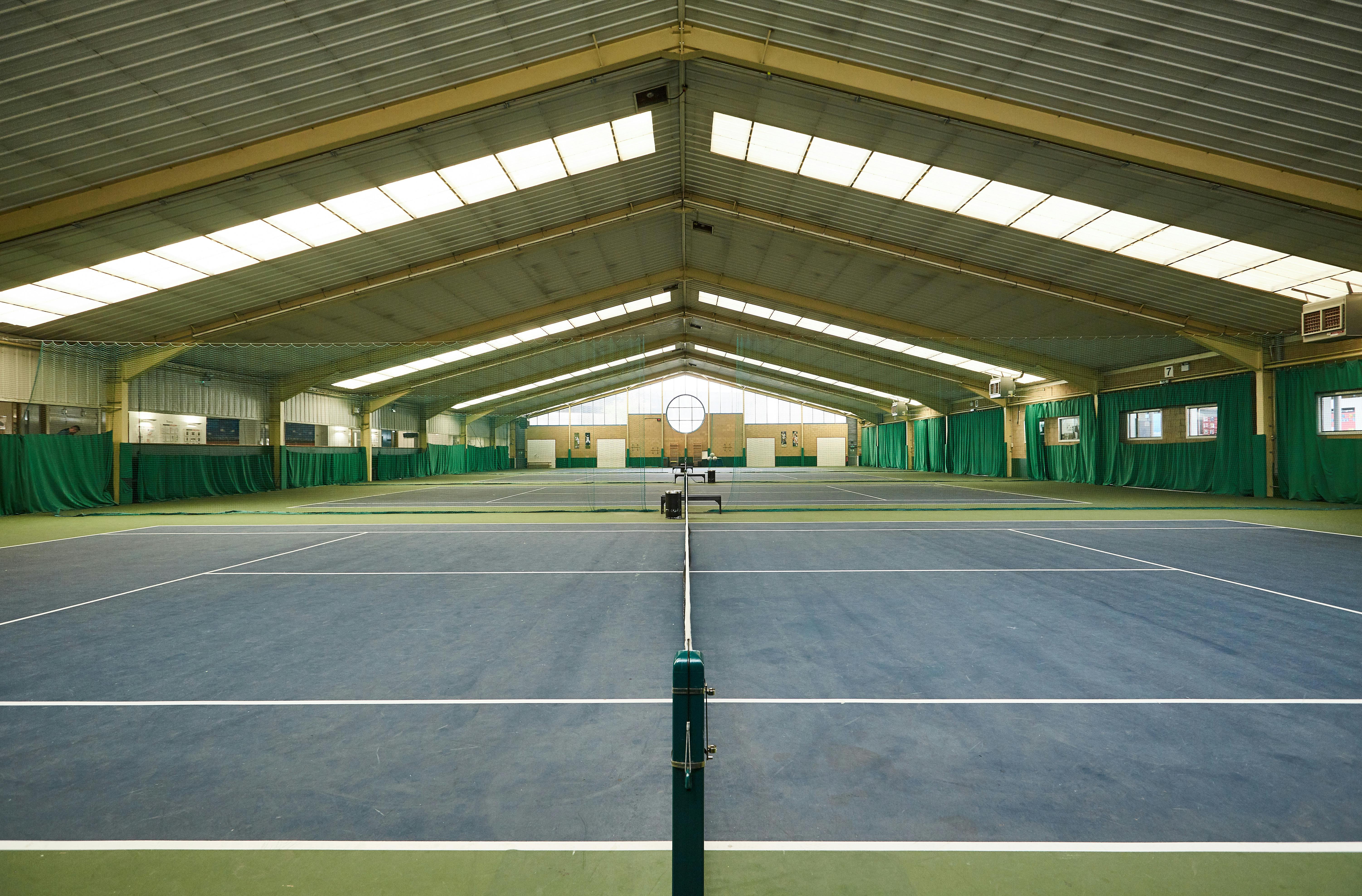 Indoor tennis courts at Westway Sports & Fitness Centre, perfect for corporate events and tournaments.