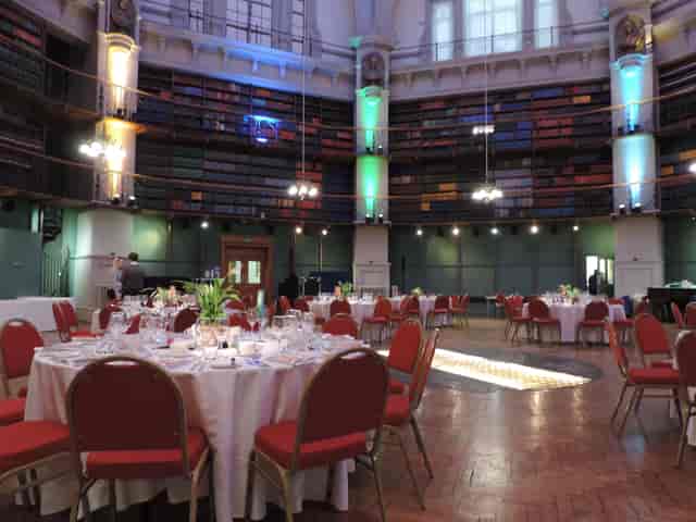 Elegant Octagon venue with round tables, ideal for corporate events and formal dinners.