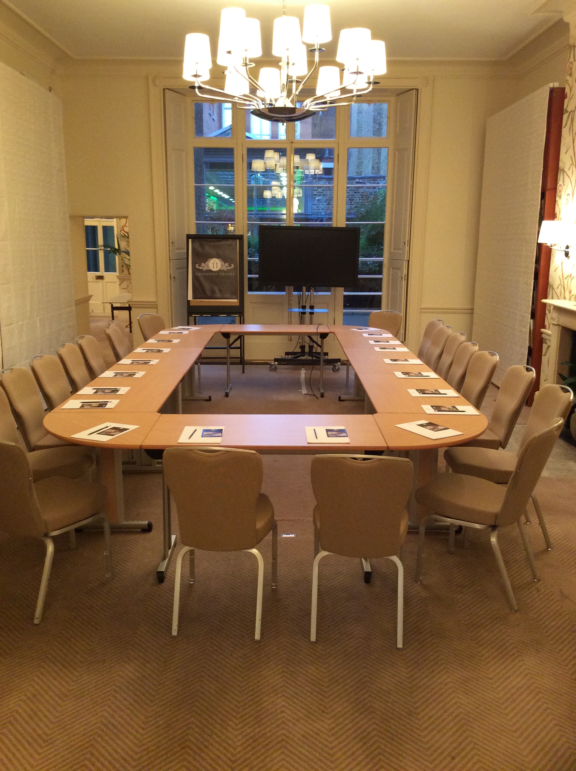 Garden Room at No.11 Cavendish Square, U-shaped table setup for professional meetings. - Banner