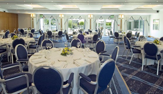 Longley Suite at Arora Hotel: elegant banquet room with natural light for events.