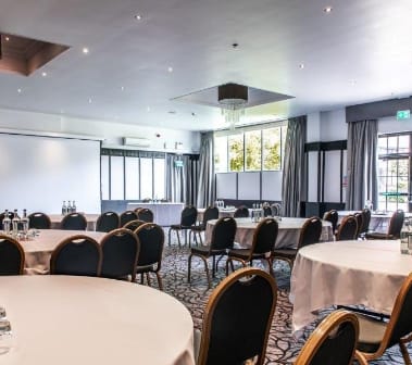 Grand Ballroom at Crowne Plaza Felbridge, elegant setup for corporate meetings and workshops.