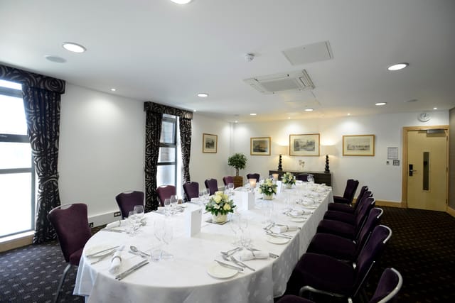 Elegant Lloyd Room meeting space with floral decor for corporate events.