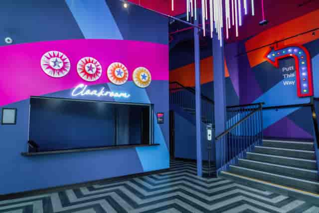 "Vibrant Christmas event at Puttshack Lakeside with modern decor and inviting atmosphere."