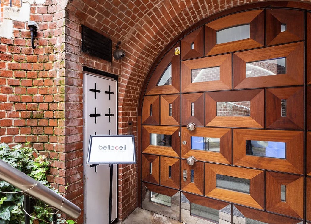 BelleCell Clinic consultation room entrance with geometric wooden door for upscale events.