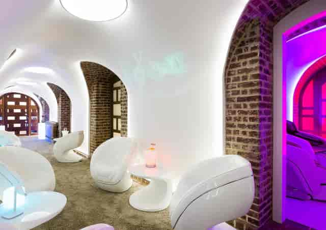 Modern consultation room with curved walls, ideal for wellness retreats and networking events.