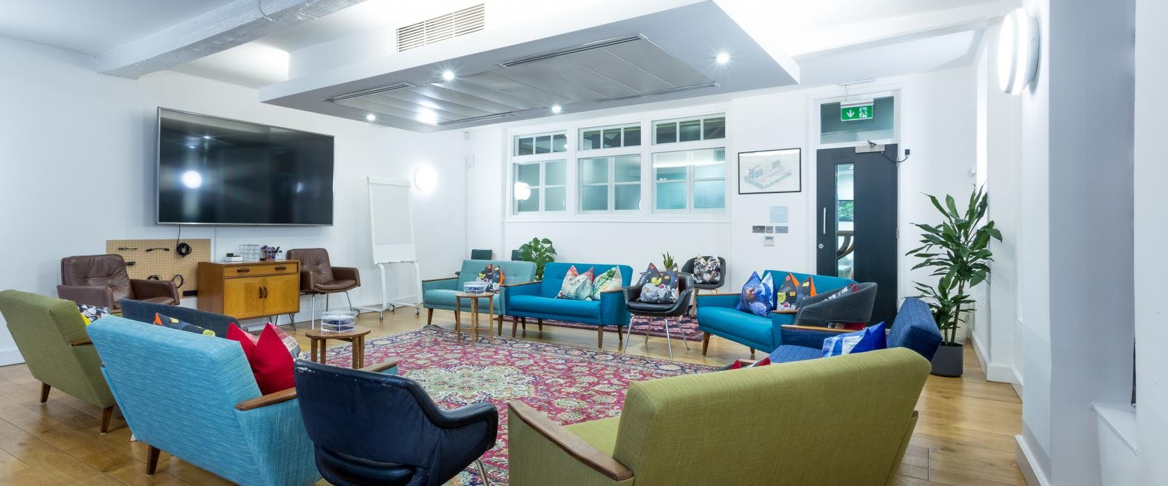 Versatile meeting space at Wallacespace Covent Garden with vibrant decor for collaboration.