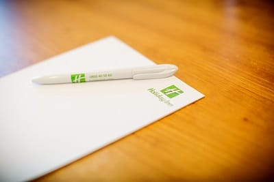Hughenden meeting room at Holiday Inn High Wycombe with branded notepad and pen.