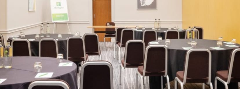 Hampshire Suite meeting room with round tables, perfect for corporate events and workshops.