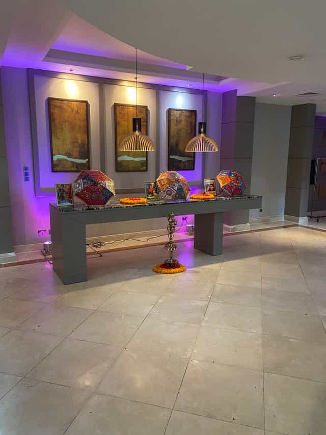 Ivy Suite event setup with vibrant umbrellas and floral decor at The Crown London Hotel.