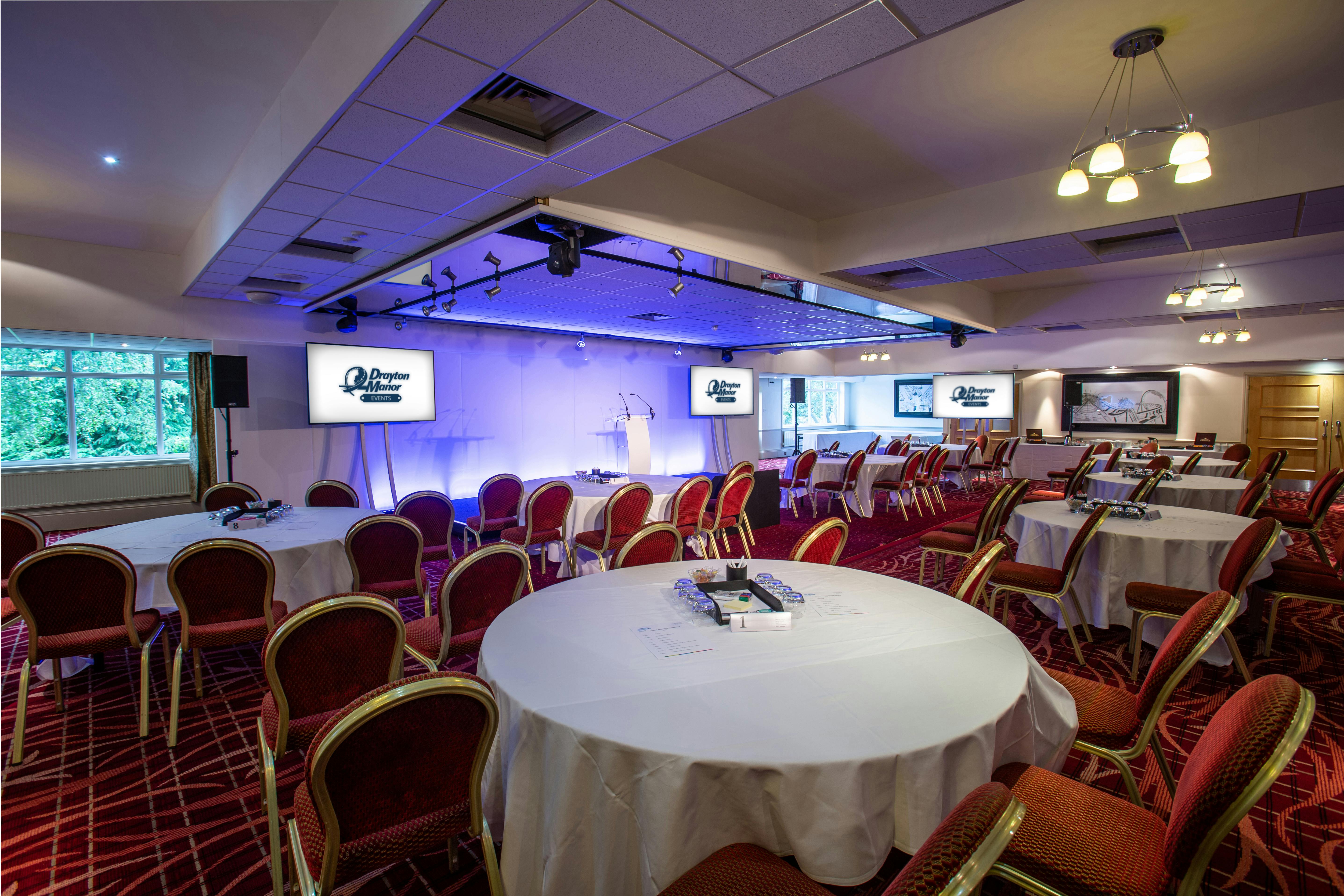 Hamilton Suite at Drayton Manor Hotel, ideal for corporate events with round tables.