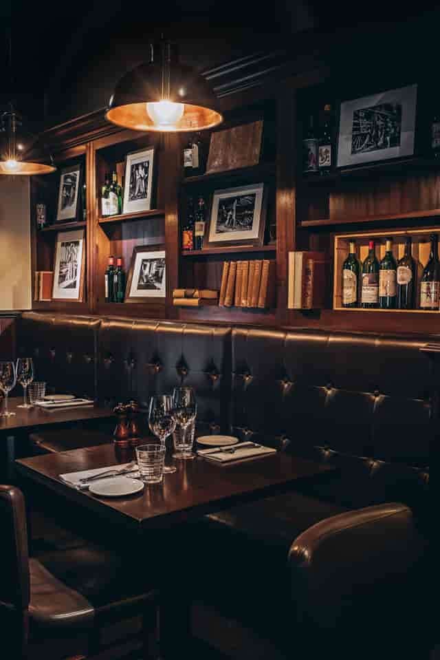 Private dining room in Goodman Mayfair with warm wood accents, ideal for intimate events.