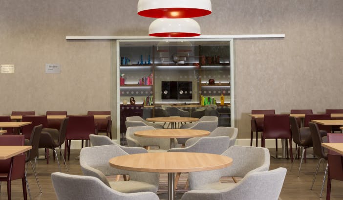 Modern dining area in Staybridge Suites Birmingham for meetings and events.