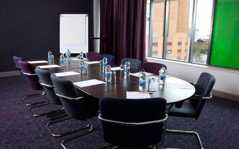 Meeting Room 7 at Clayton Hotel Cardiff with oval table, ideal for professional events.