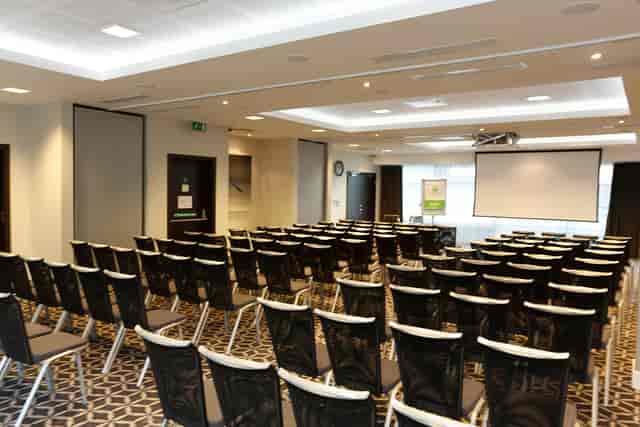 Laker Suite meeting room with black and white chairs, perfect for conferences or workshops.