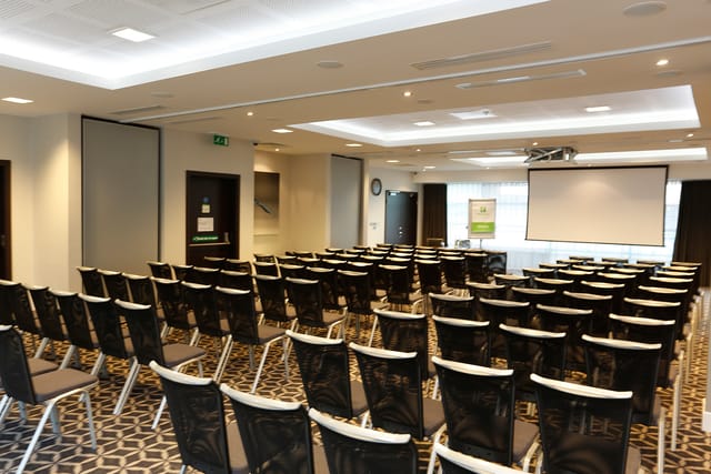 Laker Suite meeting room with black and white chairs, perfect for conferences or workshops.