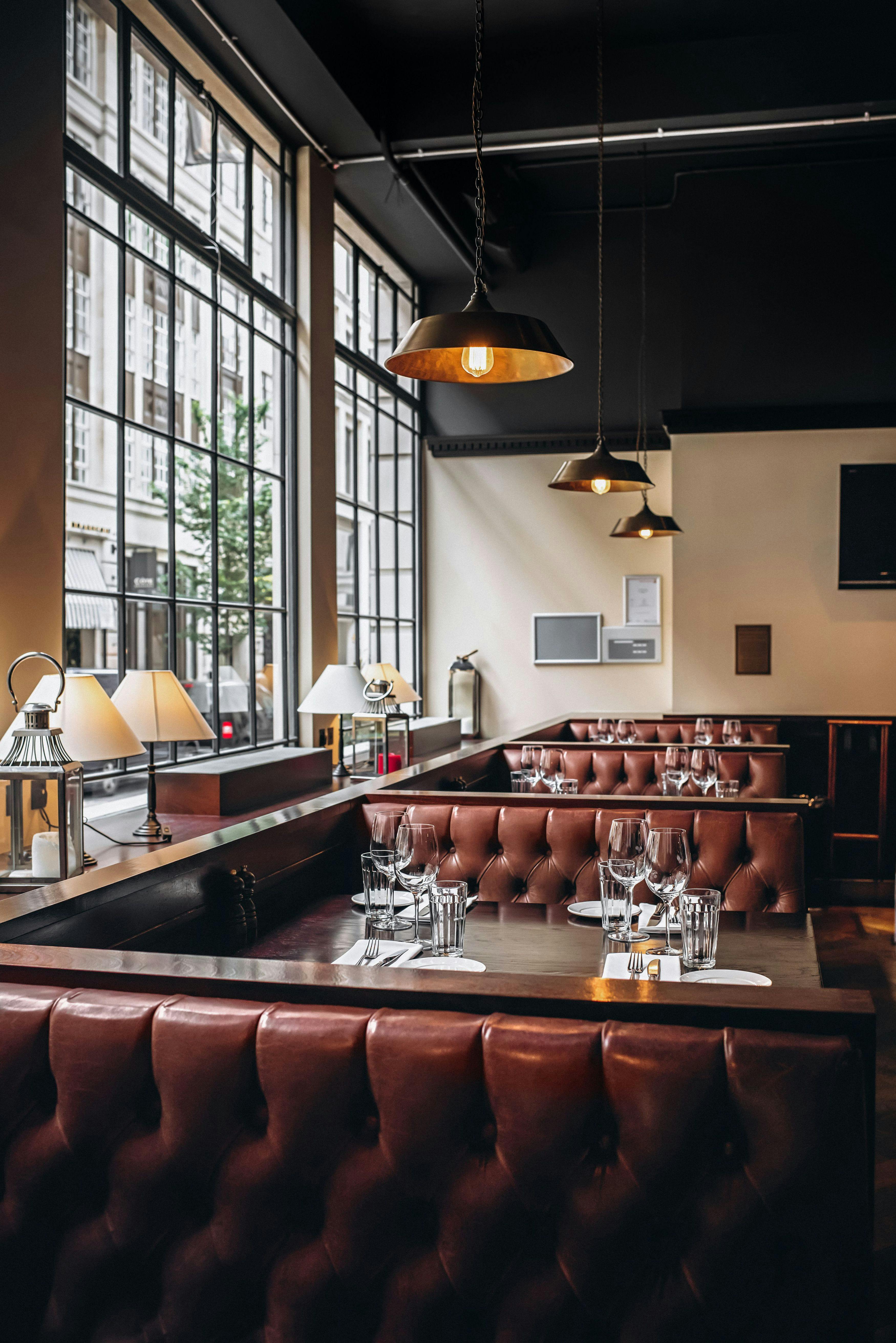 Stylish restaurant interior with plush seating, perfect for upscale events and corporate dinners.