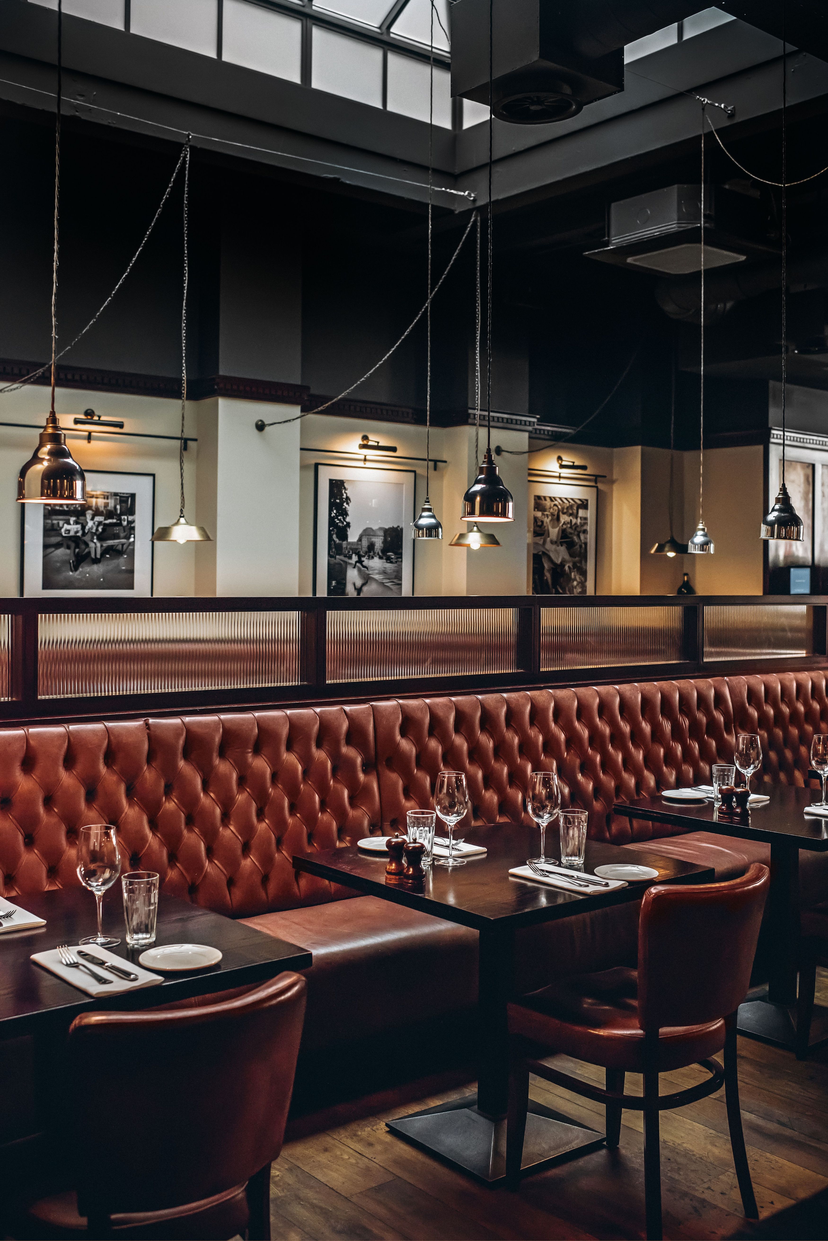 Semi-private restaurant space with leather seating, ideal for intimate gatherings and corporate events.