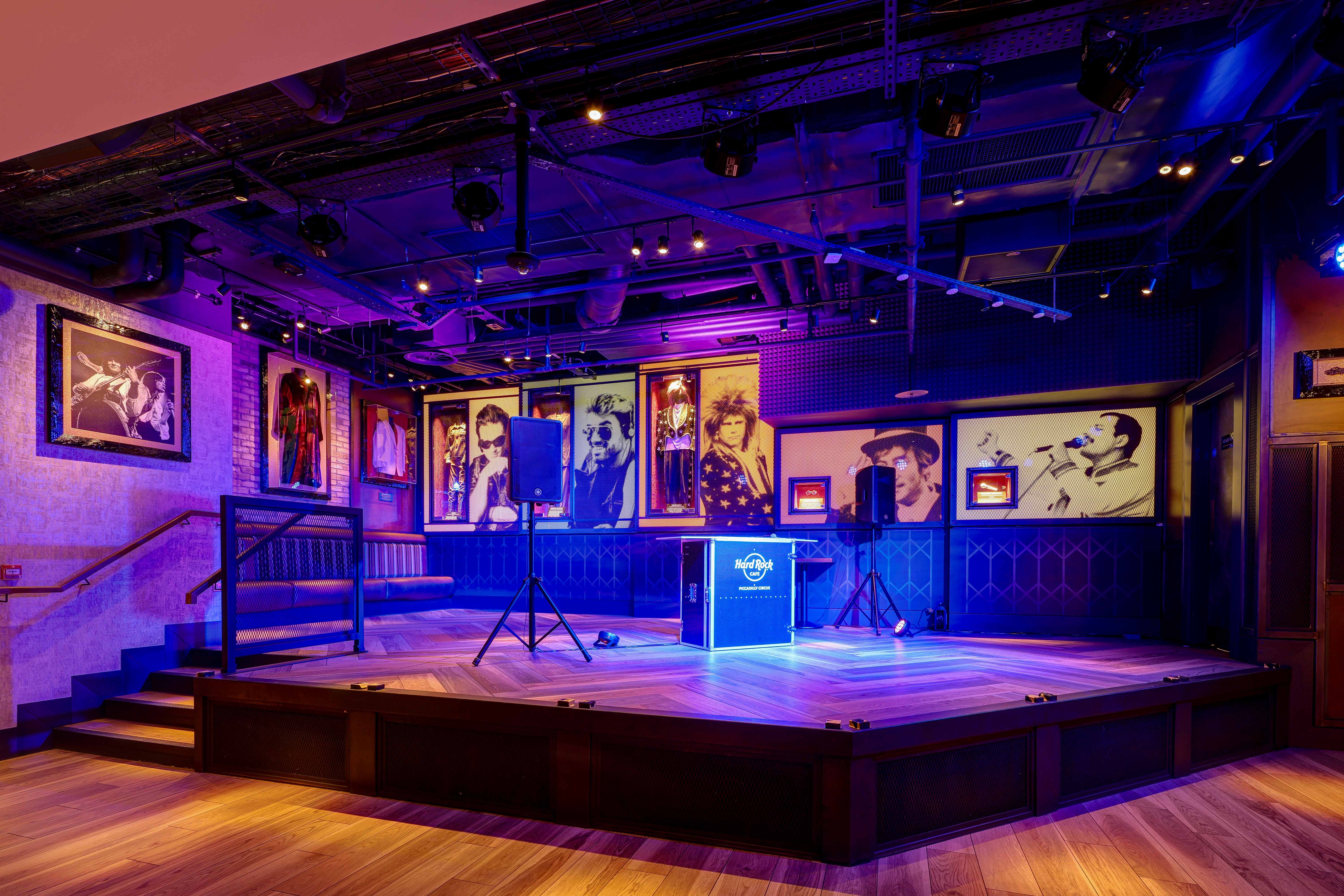 Vibrant event space at Hard Rock Cafe Piccadilly Circus with polished wooden stage. - Banner