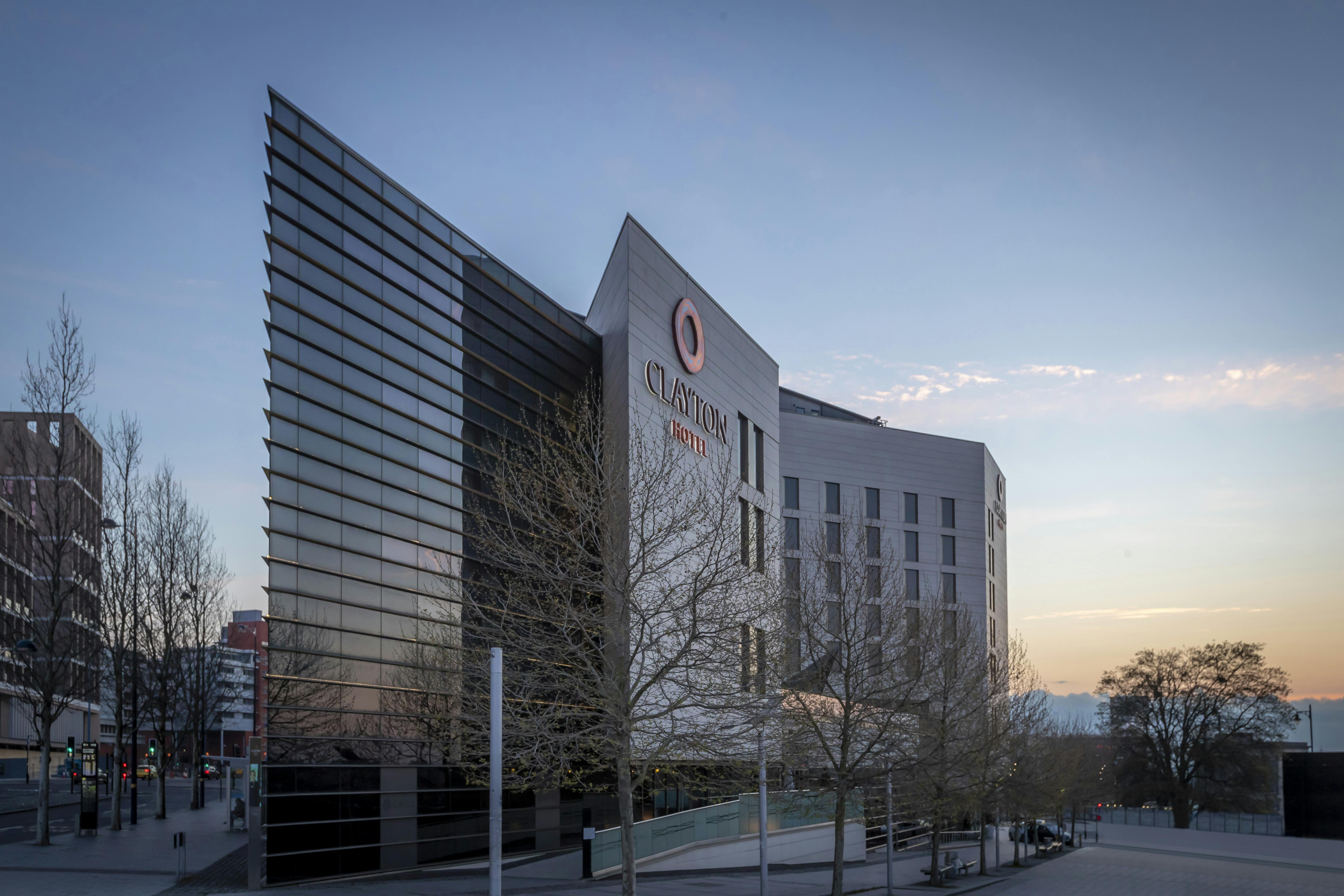 Modern conference room with glass facade at Clayton Hotel Birmingham for corporate events.