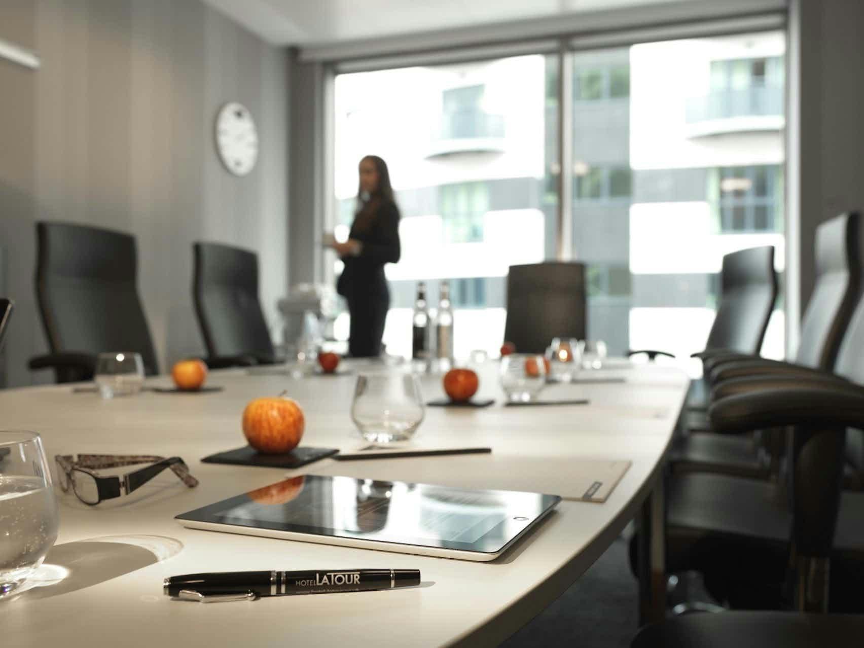 Modern meeting room with sleek table, ideal for professional gatherings in Birmingham.