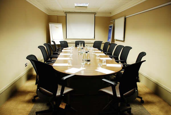 Kirkstall meeting room at Crowne Plaza Leeds with oval table, ideal for corporate events.