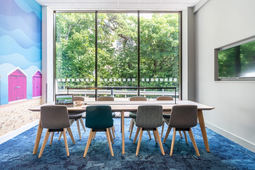 Modern meeting room at Holiday Inn Bournemouth with large table and natural light.