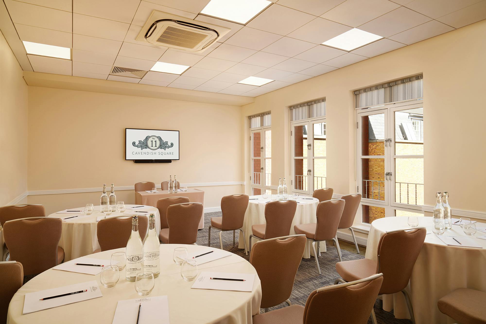 Marlborough 3 meeting room with round tables, ideal for workshops and conferences.