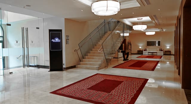 Elegant ballroom with polished floors, ideal for events and networking in Vienna.