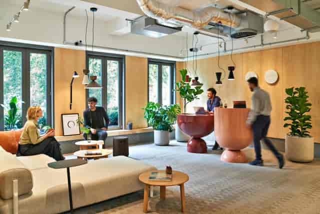 Modern breakout area with soft seating for corporate meetings and networking events.