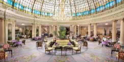 Elegant event space at Hotel Westin Palace with a glass-domed ceiling for upscale gatherings.