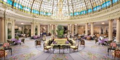 Hotel Westin Palace event space with glass-domed ceiling, perfect for upscale conferences and gatherings.