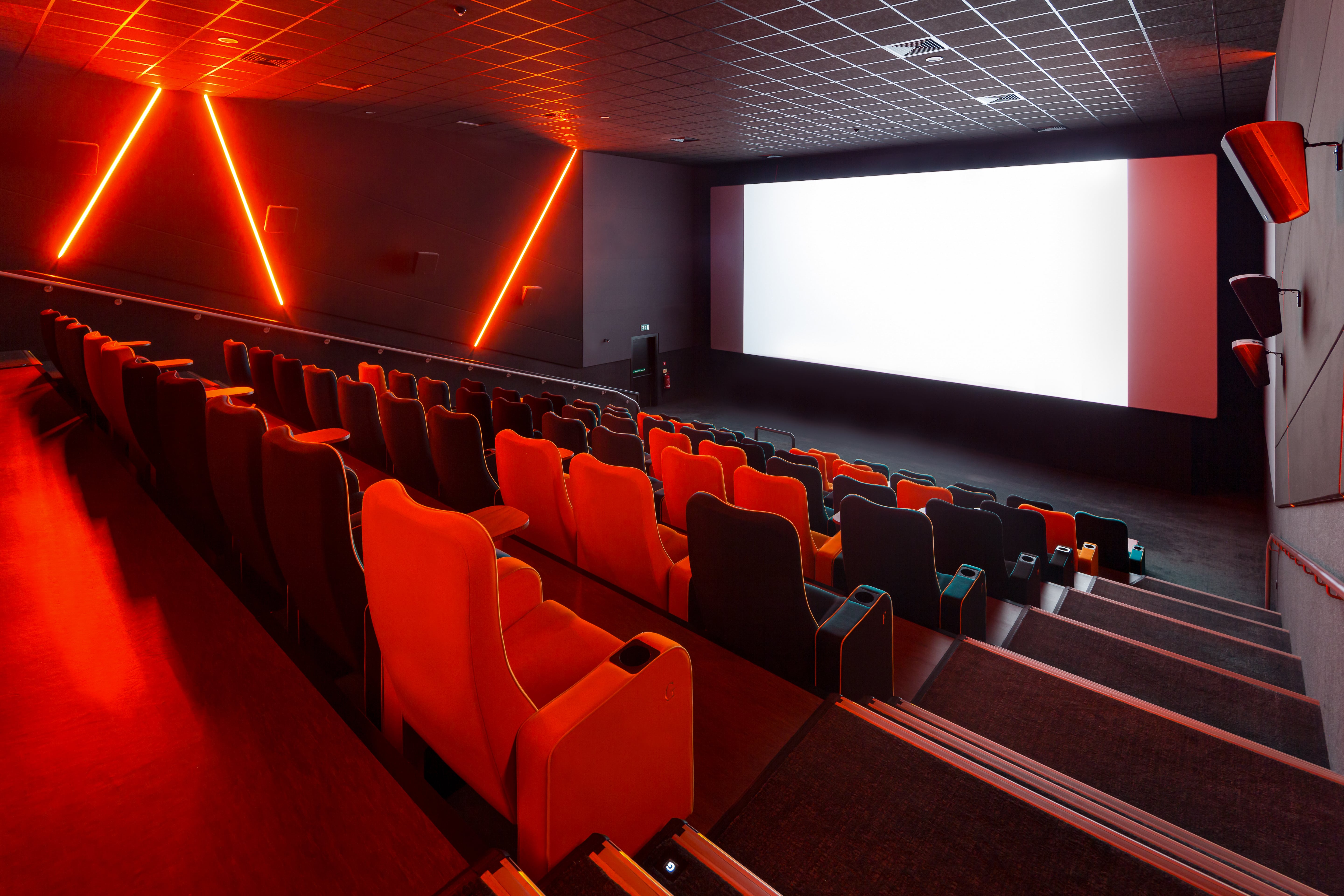 Modern cinema auditorium with sleek seating for film screenings and events. - Banner