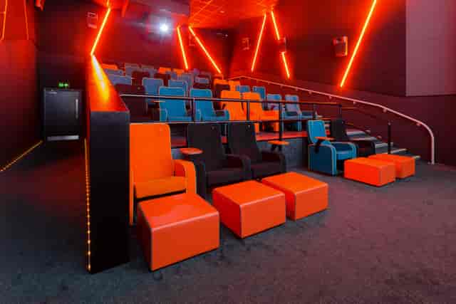 Modern auditorium with colorful seating at The Light Cinema Stockport for events and meetings.