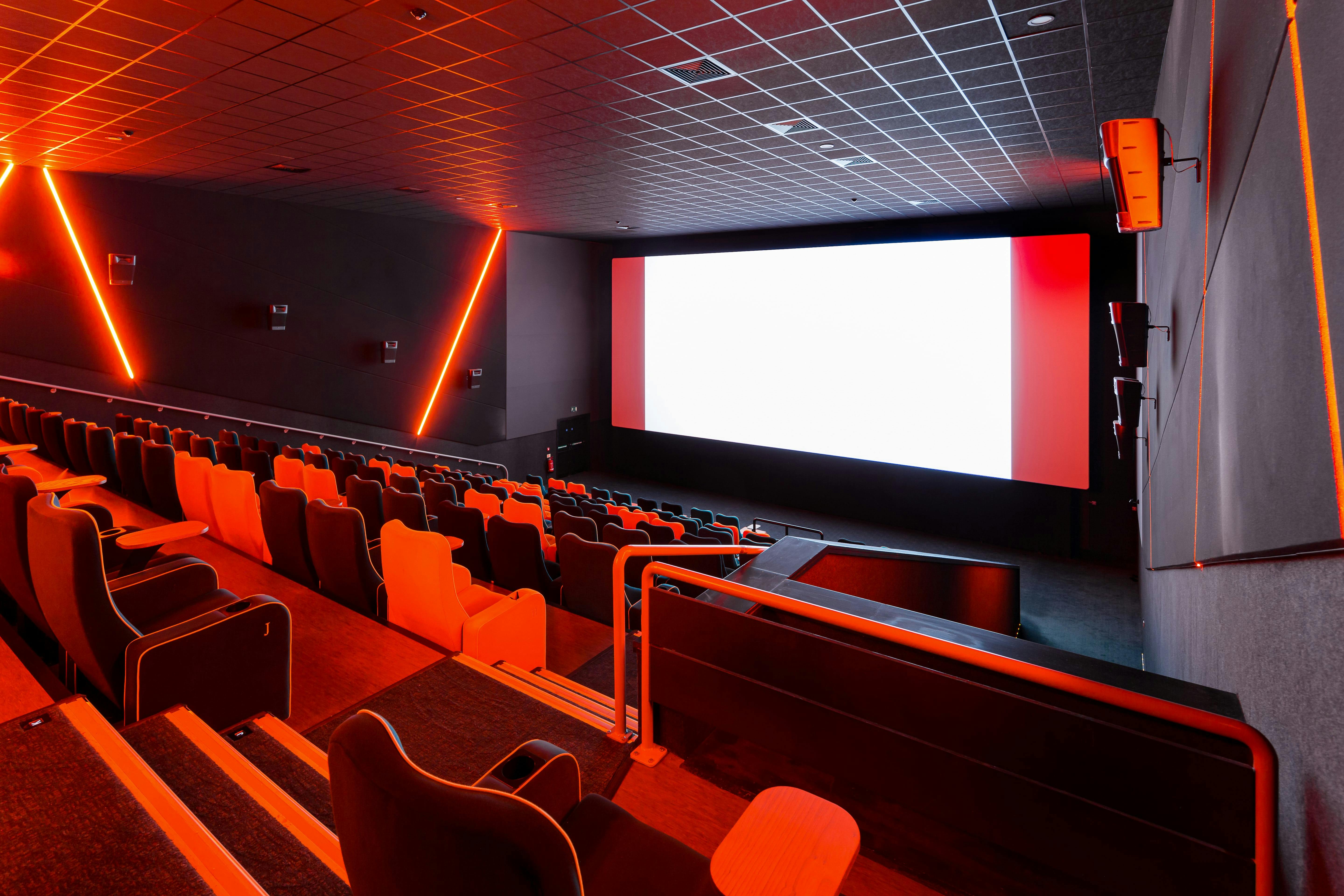 Modern cinema auditorium with tiered seating for film screenings and corporate events.