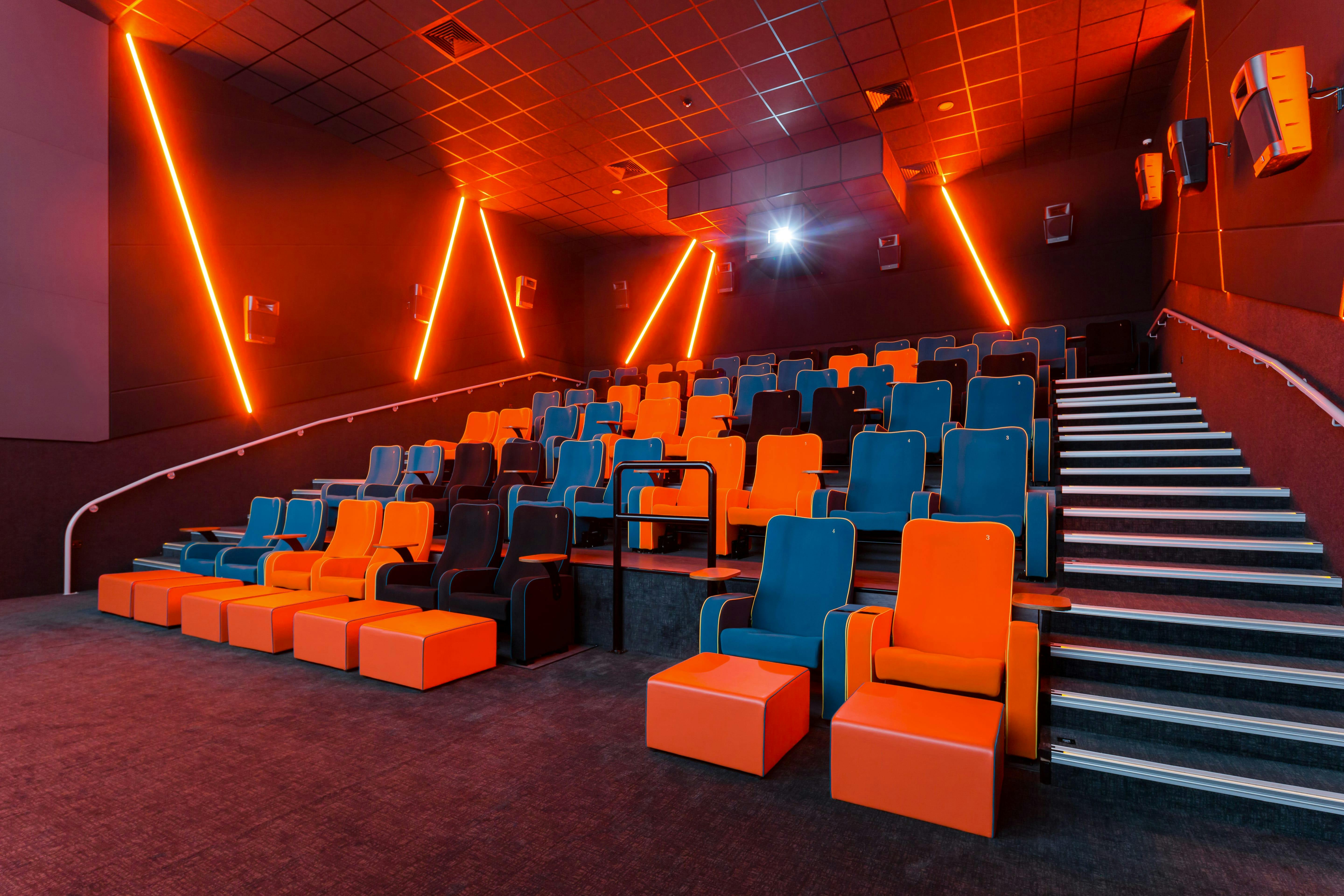 Modern auditorium with vibrant seating for film screenings and workshops at The Light Cinema.